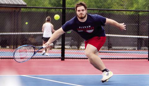 Putnam County's Tristan Williams extends his body for a ball in last week's match against Cook. (LANCE MCCURLEY/Staff)