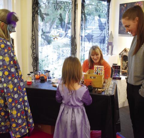 Participants dressed up at the Haunted Milledgeville reception and joined together in making potion souvenirs to take home. BAILEY BALLARD/Staff