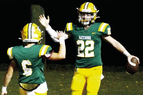 Gatewood senior Hunter Johnson (22) celebrates his second touchdown of the opening quarter Friday night with sophomore teammate Drew Love in what turned out to be a 48-6 win over the visiting Thomas Jefferson Jaguars. IAN TOCHER/Staff