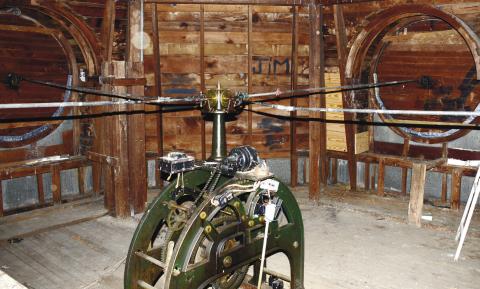 The clock mechanism in the dome atop the historic Putnam County Courthouse sends its timekeeping to the hands of four clock faces via the horizontal rods in the top half of the image. IAN TOCHER/Staff