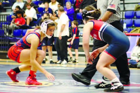 Lily Frisch starts her match against a Lamar County opponent. ARELLA CASH/Staff