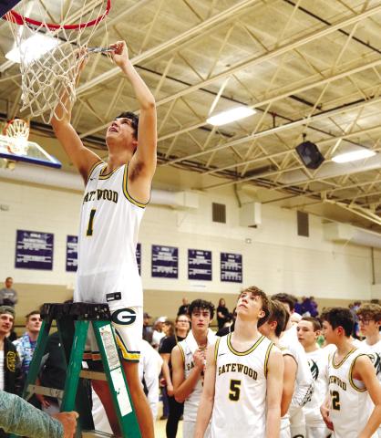 Gatewood senior Jackson Morris (1) cuts down a piece of a net after the Gators stomped Brentwood Academy to win the district title last Friday. BOB BETZEL/Contributed