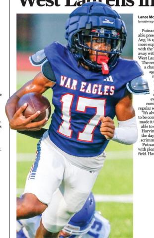 Putnam County running back Rasha Ellison breaks loose for a big gain during the War Eagles’ 24-21 scrimmage win over West Laurens on Friday night. LANCE McCURLEY/Staff
