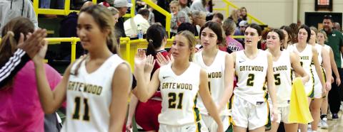 The Lady Gators high-five after a game last week. TREY NORRIS/Staff
