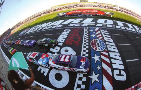 Denny Hamlin, driver of the #11 FedEx Ground Toyota, leads the field to the green flag to start the Cup Series Coca-Cola 600 at Charlotte Motor Speedway Sunday. After a wild double OT run, he’d be there for the checkered flag as well. (James Gilbert/Getty Images)