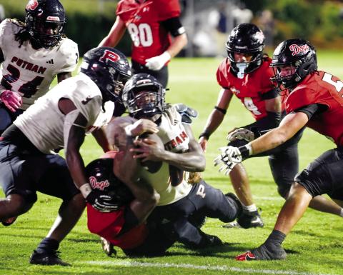 Putnam County senior running back Omarion Butts (6) dives across the goal line late in the second quarter as a Morgan County defender failed to bring him down. IAN TOCHER/Staff
