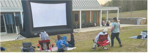 Movies are viewed on the lawn next to the interpretive center at Andalusia in Baldwin County. TYLER KARRAKER/Staff