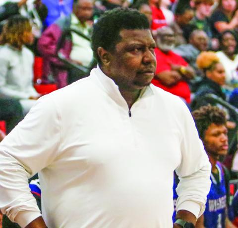 Putnam County boys basketball head coach Patrick Marshall watches his team from the bench in a game against Social Circle on Feb. 4. LANCE MCCURLEY/ Staff
