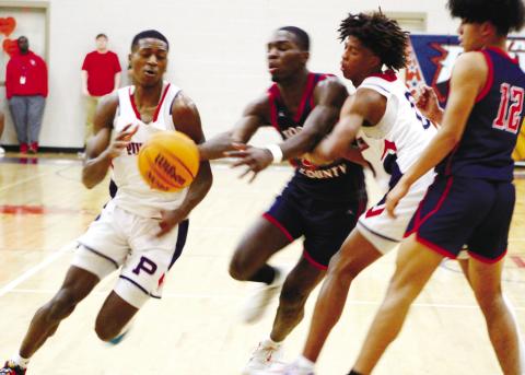 Senior Eren Banks (1) drives the lane against a Toombs County defender in the War Eagles’ first-round win last Tuesday. ARELLA CASH/Staff