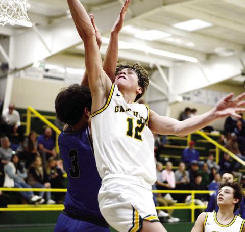 The thousandth point in action! With this score against Trinity Christian, Gatewood’s Matt Allen (12) put the final two points on the board to earn him membership in the exclusive 1,000-points club. As a sophomore, Allen still has plenty of time to add to his career total, too. IAN TOCHER/Staff