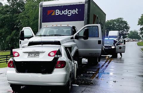 The driver of this Toyota Corolla was killed when the car crashed straighton into the Budget Rental box truck Friday afternoon on the Sparta Highway. CONTRIBUTED/PCSO