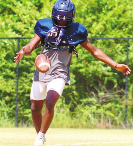 War Eagles' punter DJ Bland (4) working on his skills during special teams drills. LANCE McCURLEY/Staff