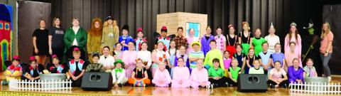Gatewood music and drama teacher Beth Mappes (standing, second from left) led a sizable crew and cast in presenting the classic “Wizard of Oz” to sold-out crowds last week at the Eatonton-based school. CONTRIBUTED