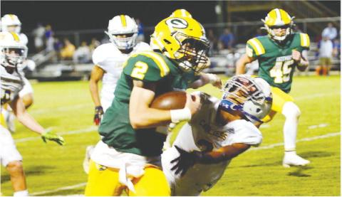 Back-up quarterback Ben Brannen (2) pushes off an Augusta Prep defender on his way to scoring a third-quarter touchdown in Gatewood’s 62-6 win over the visiting Cavaliers. IAN TOCHER/Staff