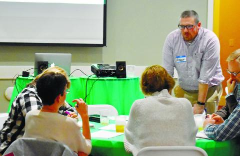GaFCP Regional Manager Adam Swymer checks on the discussion in one of the small groups.