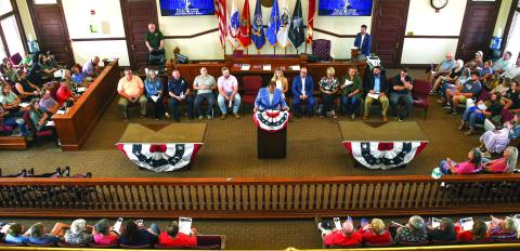 Pastor Tim Oliver of Lakeside Baptist Church (at podium) gave a wide-ranging, often forceful speech about faith and courage. IAN TOCHER/Staff