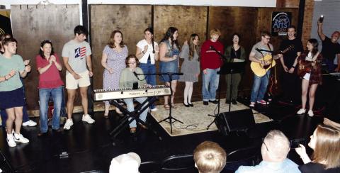 Around 10 entertainers took turns at the microphone at Sylvia's Coffee in downtown Eatonton. (IAN TOCHER/Staff)