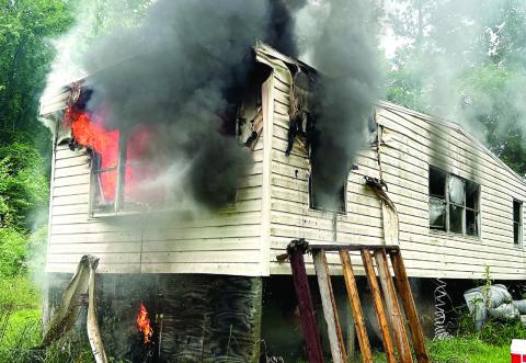 The fire in this single-wide was reportedly caused by a window unit air conditioner plugged into an extension cord. CHIEF WILLIAMSON/Contributed
