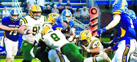 Gators defenders Blake Daniel (95), Demarion Maddox (8) and Dakota Davis (30) combine to make the stop on a Cavaliers ball carrier. DAWN SINCLAIR/Contributed