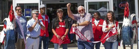 Eatonton-Putnam Chamber of Commerce President Robbie King (second from left) and Putnam County Commission Chairman Bill Sharp flank Tractor Supply store manager April Smith after she cut the ribbon on Saturday to officially open the company’s new Eatonton location. IAN TOCHER/Staff