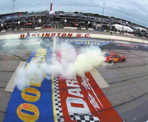 Joey Logano, driver of the #22 Shell Pennzoil Ford, celebrates with a sweet burnout after winning the Cup Series Goodyear 400 at Darlington Raceway Sunday. (Emilee Chen/Getty Images)