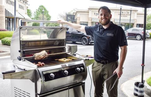 Stephen Montgomery with Fire Magic Premium Grills cooked brats, burgers, grilled fruit, pizza and more to show off one of the company’s grills. CONTRIBUTED