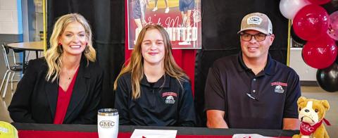 Flanked by her parents, PCHS senior Jade Mullis recently commited to continue her golfing career and education at Georgia Military College in Milledgeville. CONTRIBUTED