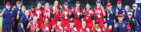 USA softball staff AND TEAM members claim their first place medals after taking down Japan. CONTRIBUTED