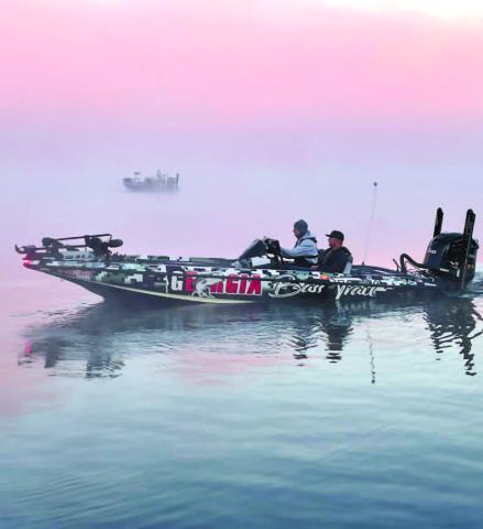 Anglers depart beneath an early morning fog hovering over Lake Oconee. CONTRIBUTED