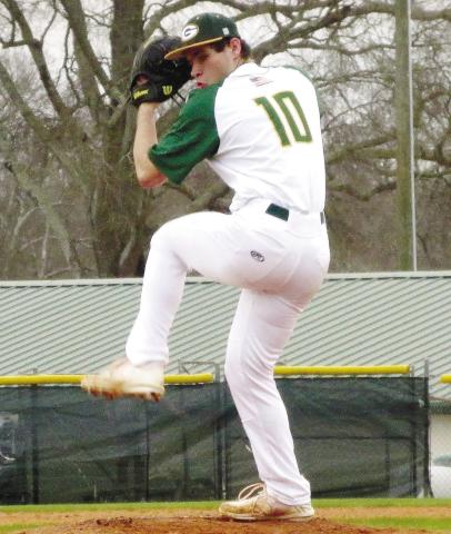 Wilson Moore (10) gets set from the bump as he prepares to deliver a pitch. TREY NORRIS/Staff