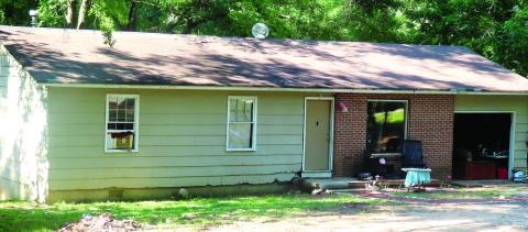 Tommy Lee Kell barricaded himself in the attic of his house and threatened a shoot-out with the officers. (CONTRIBUTED)