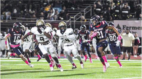 With support from teammates Ethan Whatley (16), Mark Little (6) and Jason Clemons (80), Putnam County senior Alan Hill (21) makes a run around the Thomson defense in a game played earlier this season. CHARLES JORDAN/File photo
