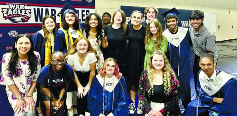 Members of the Putnam County High School chorus group take time out from rehearsing their presentation before this year’s graduation ceremonies at War Eagles Stadium last month. CONTRIBUTED