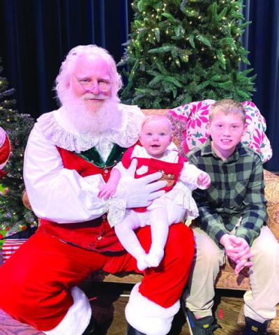 Naughty or Nice? Hunter Lukes, age 8, and his baby sister Zoey were definitely nice this year and couldn’t wait to see Santa! EMME CLAUSE/Staff