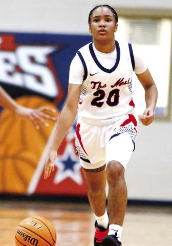 Putnam County freshman Jada Baker brings the ball up the floor in transition during a game earlier this season. LANCE McCURLEY/Staff