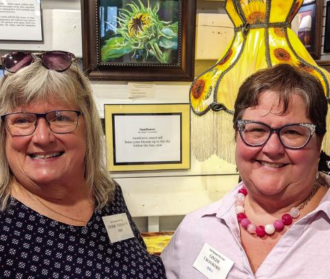 Artist Debbie Anderson (left) submitted her artwork “Potential,” inspired by author Ginger Crosswhite’s “Sunflower,” a haiku style poem. CONTRIBUTED