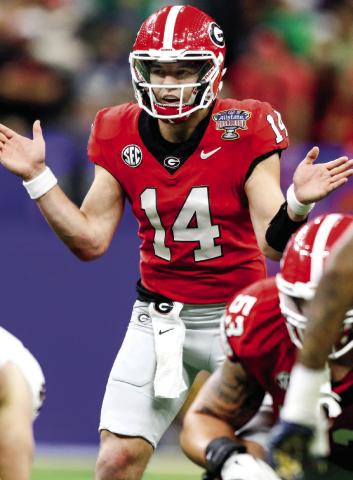Georgia quarterback Gunner Stockton (14) gets set to snap the ball during the third quarter of the Allstate Sugar Bowl against Notre Dame. (LANCE MCCURLEY/Staff)
