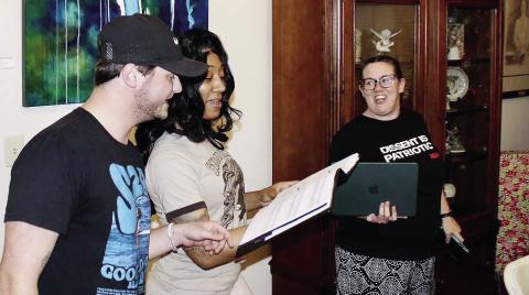 L-R: Tyler Stella and Ariel McKinney rehearse a song for “Hairspray the Musical,” with stage manager Anna Walker looking on in The Plaza’s foyer. CONTRIBUTED