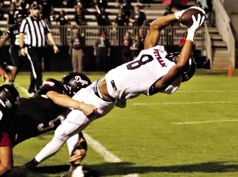 Cedrion Brundage bends over backwards to break the goal line plane and score Putnam County’s first touchdown of the 2021 season against the Morgan County Bulldogs, leading to a 37-0 rout. (File Photo)