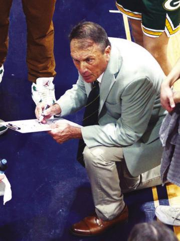 Gatewood’s Don Keiser commands the attention of his players during a playo game last season in Macon. IAN TOCHER/Staff