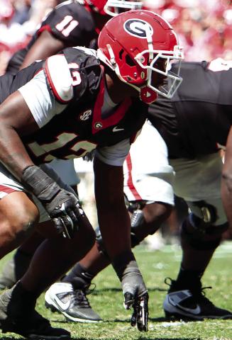 Georgia edge rusher Mykel Williams (13) lines up before a play during the annual G-Day scrimmage. (LANCE MCCURLEY/Staff)