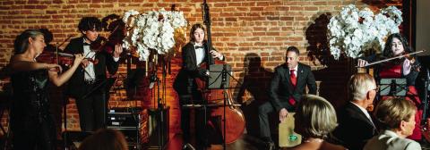 Celebrated violinist and arts educator Amy Schwartz Moretti (left) performed at OPAS Soirée en Blanc &amp; Noir with her Mercer University string students. CONTRIBUTED
