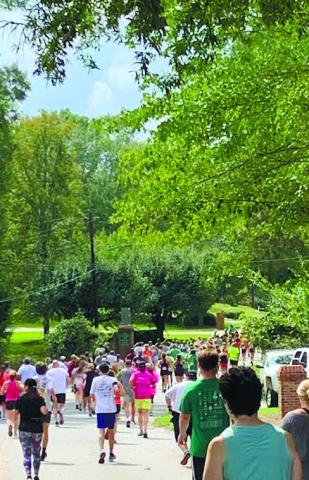 Last year’s 5K for Kaye Swamp Stomp attracted hundreds of walkers and runners to the streets of Eatonton. CONTRIBUTED