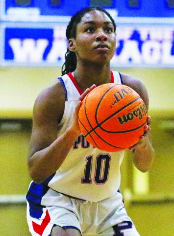 Journey Waller lines up at the free throw line during the third quarter of Putnam County’s first-round playoff game against Gordon-Lee. TREY NORRIS/Staff