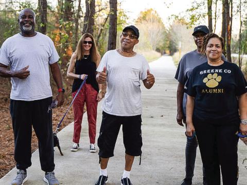 A group of pedestrians enjoys a walk on the Firefly Trail. CONTRIBUTED