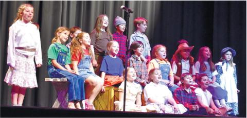 A group of young actors is sing a song about Davy Crockett. LENA HENSLEY/Staff