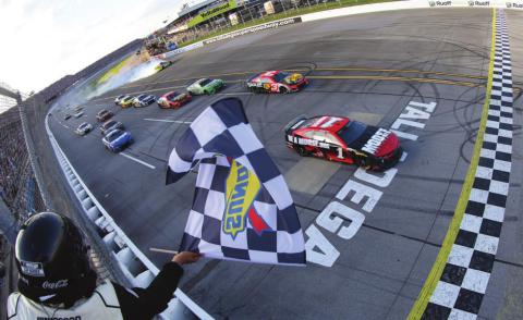 Ross Chastain, driver of the #1 Moose Fraternity Chevrolet, takes the checkered flag to win the Cup Series GEICO 500 at Talladega Superspeedway Sunday. (James Gilbert/Getty Images)