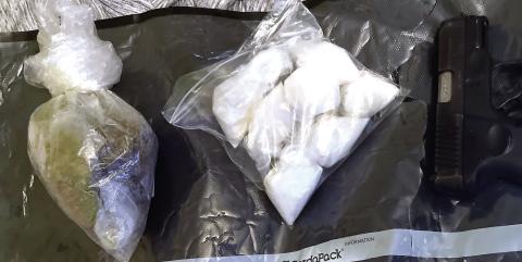 A half-pound each of marijuana and methamphetamine along with some scales were seized from a house on Sparta Highway, where almost a dozen chained dogs also were found. CONTRIBUTED/PCSO