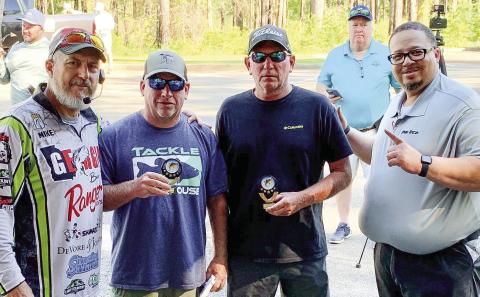 Tournament winners Lance Collins and Scott Jeffers were presented with first-place trophies from Mike Tarrar of Georgia Bass Trail (left) and Roosevelt Adams of Five Star Automotive (right). CONTRIBUTED
