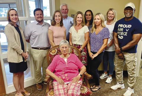 Glenda Ridley (seated) is supported by (l-r): Secretary Laura Gailey, Vice President Wil Ha-ley, Maggie Milner, Mike Rountree, Kelly Beasley, Rachel Harvey, Heidi King, Susie Noles and Bobby Lewis after her announcement of stepping down as a Putnam General Hospital Foundation member. CONTRIBUTED